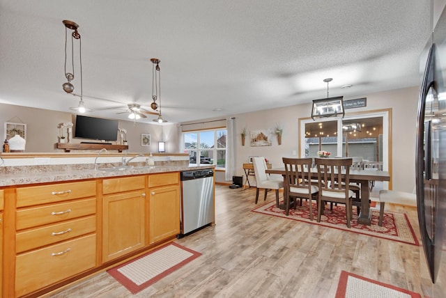 10542 188th Ave NW, Elk River, MN 55330 - kitchen with dishwasher, light countertops, a textured ceiling, light wood-style flooring, and a sink