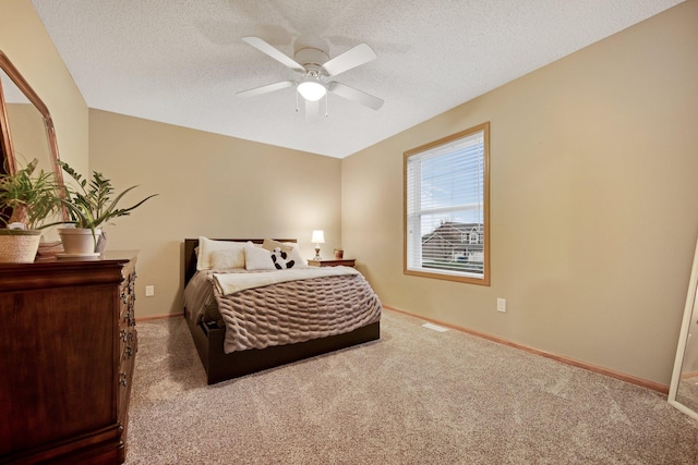 10542 188th Ave NW, Elk River, MN 55330 - bedroom with carpet, a textured ceiling, baseboards, and a ceiling fan