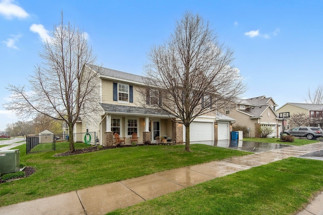 10542 188th Ave NW, Elk River, MN 55330 - view of front of house featuring a gate, asphalt driveway, an attached garage, and a porch