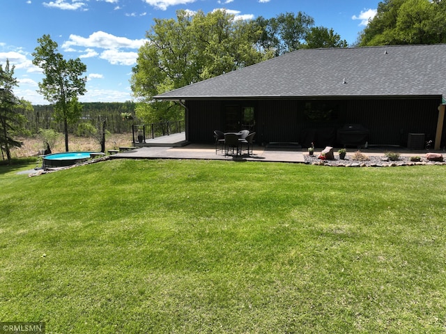 3004 370th Ave, Sandstone, MN 55072 - view of green lawn featuring a patio area