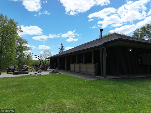 3004 370th Ave, Sandstone, MN 55072 - rear view of house featuring a lawn and a shingled roof