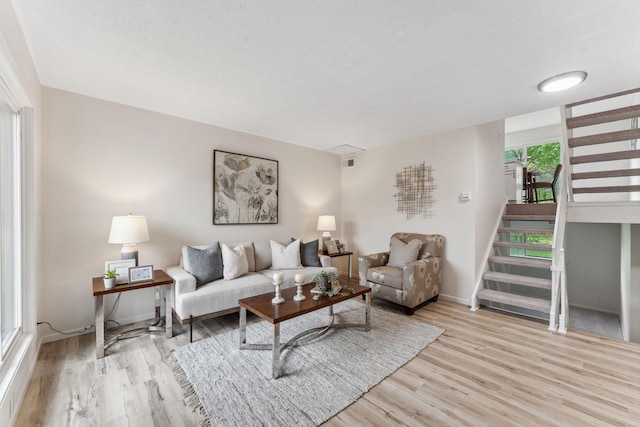 5707 80th Ave N, Brooklyn Park, MN 55443 - living room with wood finished floors, stairway, and baseboards