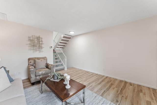 5707 80th Ave N, Brooklyn Park, MN 55443 - living room featuring wood finished floors, stairs, and baseboards
