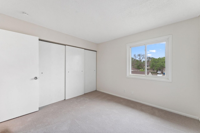 5707 80th Ave N, Brooklyn Park, MN 55443 - unfurnished bedroom featuring carpet and a closet