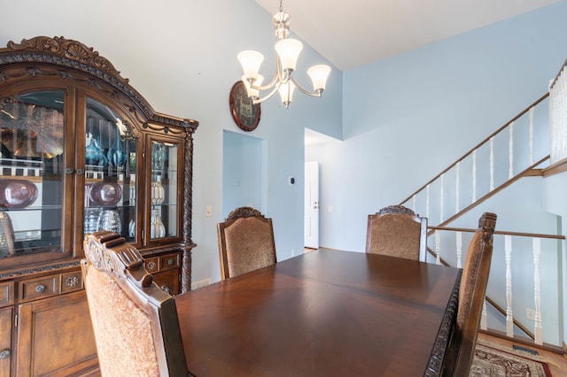 9309 Loch Lomond Ln, Brooklyn Park, MN 55443 - dining room featuring a chandelier and stairway