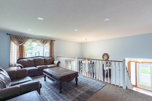 9309 Loch Lomond Ln, Brooklyn Park, MN 55443 - living area featuring a textured ceiling, carpet floors, and recessed lighting