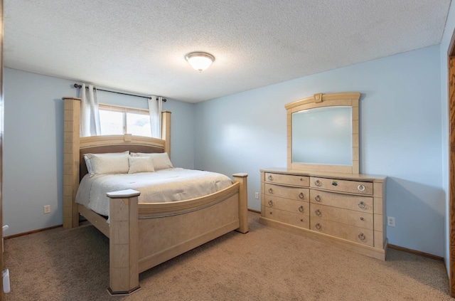 9309 Loch Lomond Ln, Brooklyn Park, MN 55443 - bedroom featuring light colored carpet, a textured ceiling, and baseboards