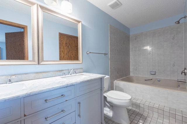 9309 Loch Lomond Ln, Brooklyn Park, MN 55443 - bathroom with toilet, double vanity, tile patterned flooring, and tiled shower / bath