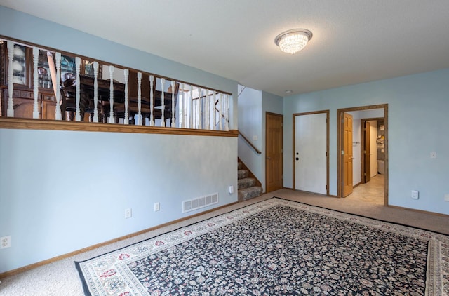 9309 Loch Lomond Ln, Brooklyn Park, MN 55443 - carpeted spare room with stairs and baseboards