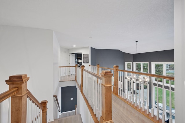 330 Lythrum Ln, Medina, MN 55340 - staircase with a chandelier, wood finished floors, and recessed lighting