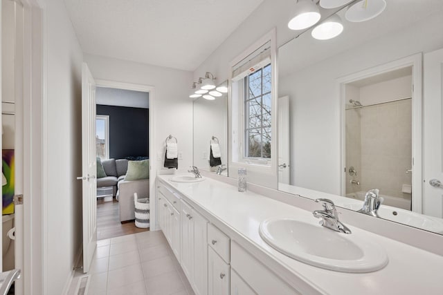 330 Lythrum Ln, Medina, MN 55340 - bathroom featuring double vanity, tile patterned floors, and tub / shower combination