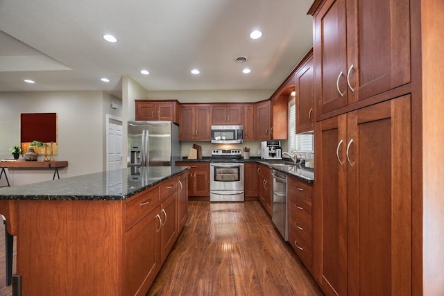 67457 152nd Ave, Greenfield Twp, MN 55981 - kitchen featuring stainless steel appliances, dark wood finished floors, recessed lighting, a sink, and a kitchen island