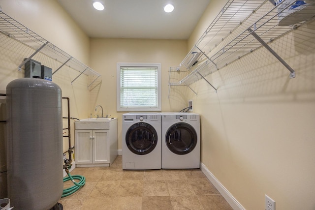 67457 152nd Ave, Greenfield Twp, MN 55981 - laundry area with washer and clothes dryer, cabinet space, baseboards, and recessed lighting