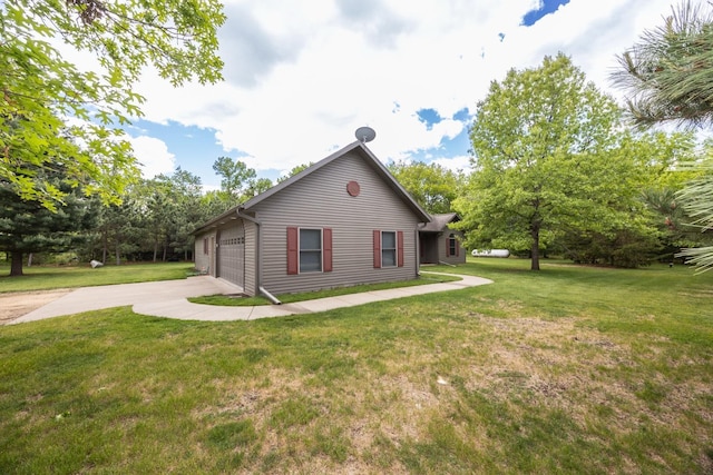 67457 152nd Ave, Greenfield Twp, MN 55981 - view of home's exterior with concrete driveway and a yard