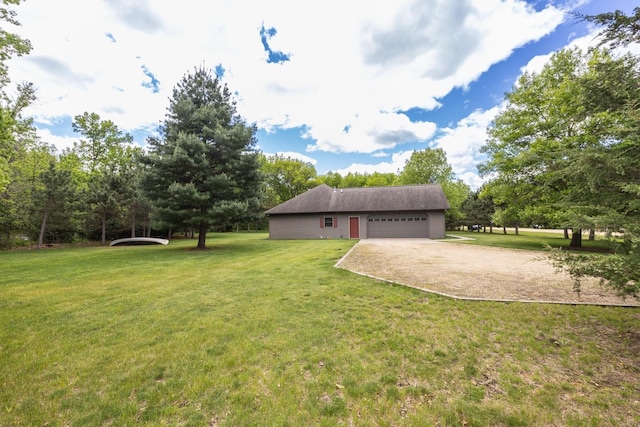67457 152nd Ave, Greenfield Twp, MN 55981 - view of green lawn featuring dirt driveway and a garage