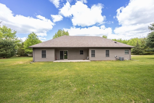 67457 152nd Ave, Greenfield Twp, MN 55981 - rear view of property featuring a patio area, a yard, central AC unit, and a shingled roof