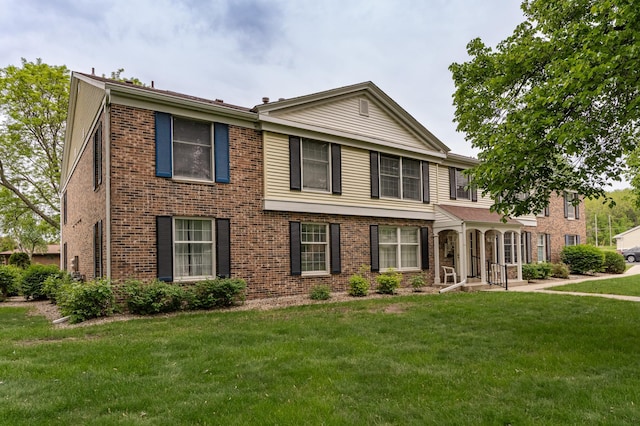 2051 Carriage Dr SW Unit 2051A, Rochester, MN 55902 - view of front facade featuring a front lawn and brick siding