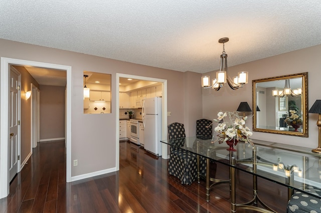 2051 Carriage Dr SW Unit 2051A, Rochester, MN 55902 - dining room featuring a chandelier, dark wood-style flooring, a textured ceiling, and baseboards