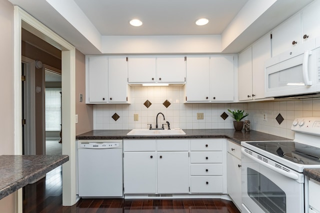 2051 Carriage Dr SW Unit 2051A, Rochester, MN 55902 - kitchen featuring white appliances, a sink, dark countertops, white cabinetry, and recessed lighting