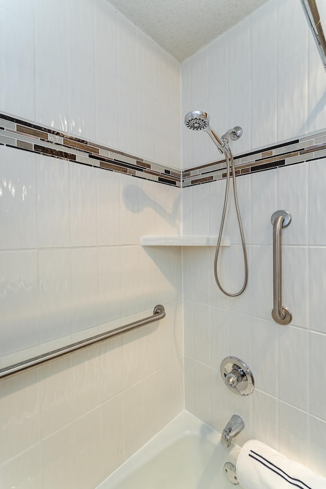 2051 Carriage Dr SW Unit 2051A, Rochester, MN 55902 - bathroom featuring  shower combination and a textured ceiling