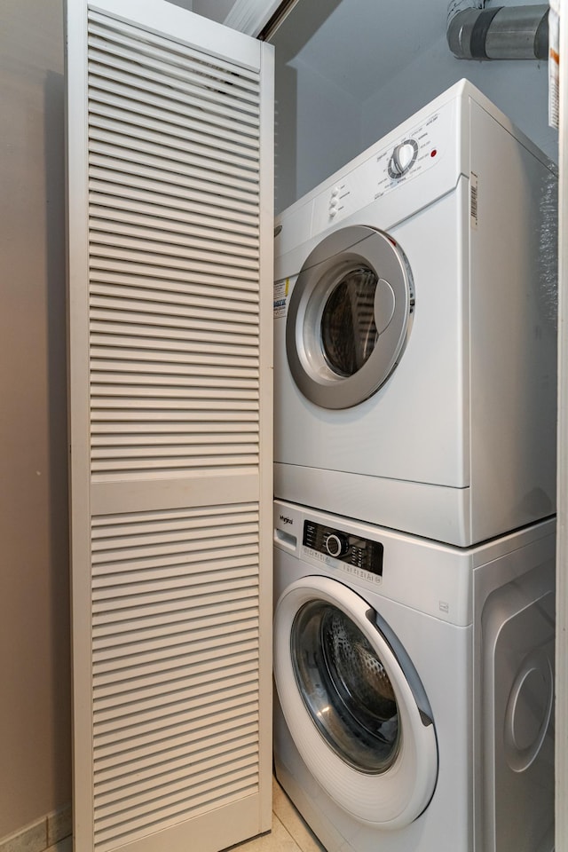 2051 Carriage Dr SW Unit 2051A, Rochester, MN 55902 - laundry room with stacked washer / drying machine and light tile patterned floors