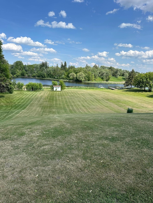 502 1st Ave SE, Baudette, MN 56623 - surrounding community featuring a lawn, view of golf course, and a water view