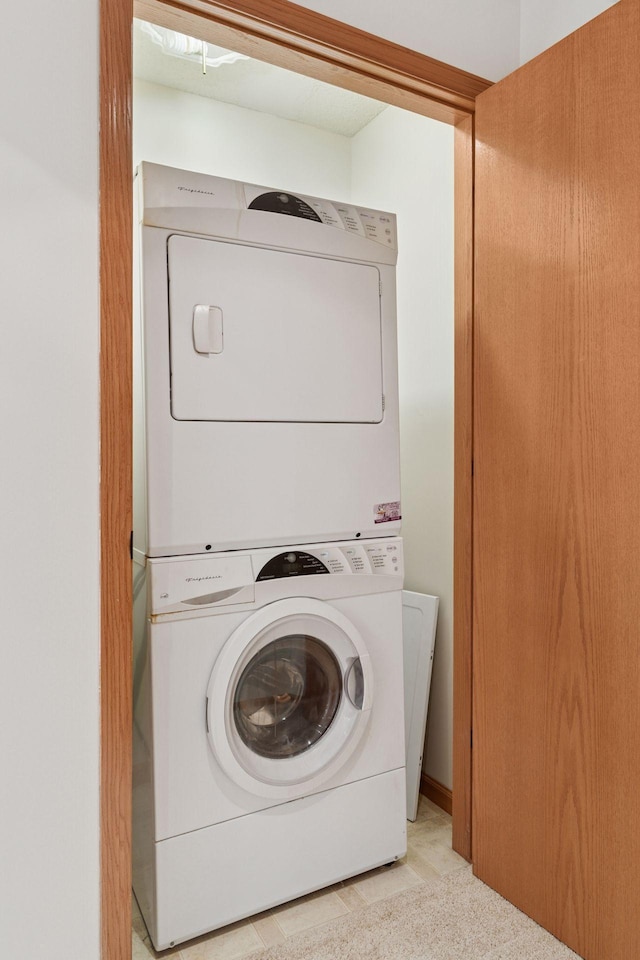 2231 Penn Pl Unit 224, North Saint Paul, MN 55109 - laundry room featuring stacked washing machine and dryer