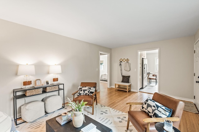 713 83rd Ave NE, Spring Lake Park, MN 55432 - living area featuring light wood-style floors and baseboards