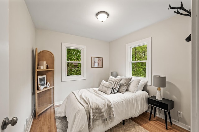 713 83rd Ave NE, Spring Lake Park, MN 55432 - bedroom with wood finished floors and baseboards