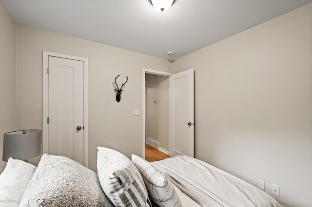 713 83rd Ave NE, Spring Lake Park, MN 55432 - bedroom featuring wood finished floors and baseboards