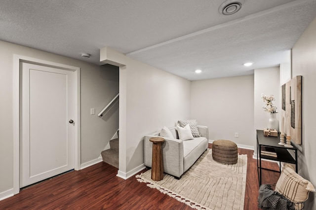 713 83rd Ave NE, Spring Lake Park, MN 55432 - sitting room featuring dark wood-style flooring, stairway, baseboards, recessed lighting, and a textured ceiling