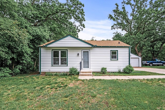 713 83rd Ave NE, Spring Lake Park, MN 55432 - ranch-style home with a front lawn, a garage, entry steps, and an outdoor structure
