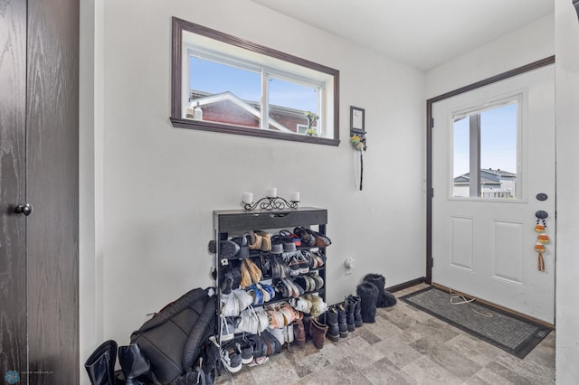 2128 Admiral Dr W, West Fargo, ND 58078 - foyer featuring stone finish flooring and baseboards