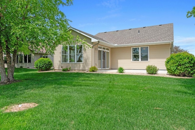 1223 Cypress Dr W, Annandale, MN 55302 - rear view of house with a yard and roof with shingles