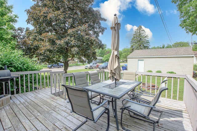 1221 11th St SE, Saint Cloud, MN 56304 - deck featuring outdoor dining area and a yard