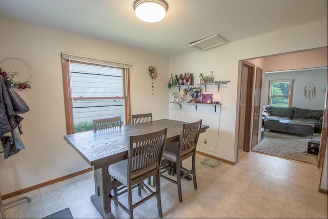 1221 11th St SE, Saint Cloud, MN 56304 - dining room featuring baseboards and light flooring