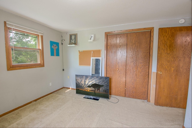 1221 11th St SE, Saint Cloud, MN 56304 - unfurnished bedroom featuring carpet and baseboards