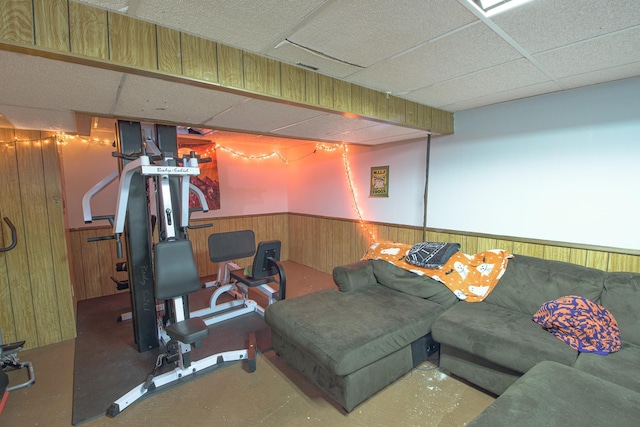 1221 11th St SE, Saint Cloud, MN 56304 - workout area with a drop ceiling, a wainscoted wall, and wooden walls