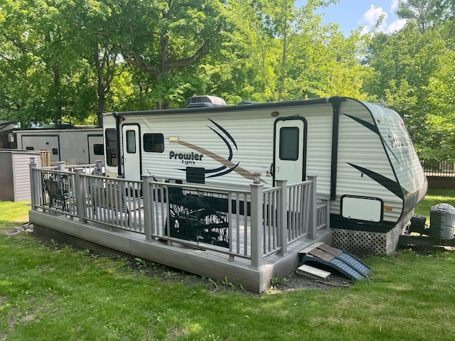 13240 Devils Lake Rd NW Unit 27And 26, Brandon Twp, MN 56315 - back of house with a deck and a lawn