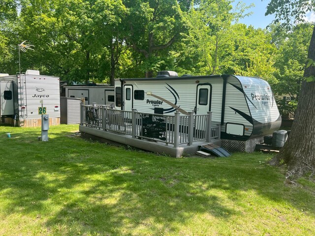 13240 Devils Lake Rd NW Unit 27And 26, Brandon Twp, MN 56315 - rear view of property featuring a wooden deck and a yard