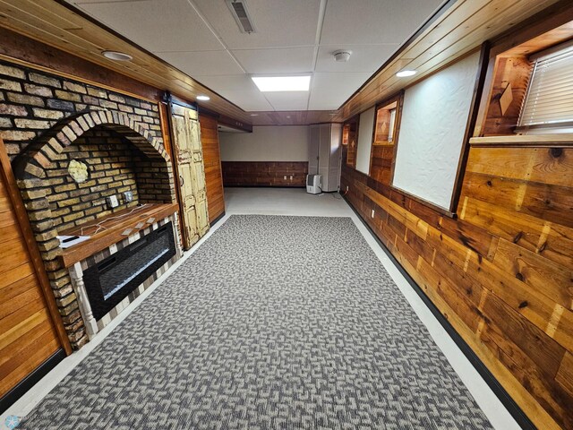 609 1st St N, Wahpeton, ND 58075 - corridor with wooden walls, a wainscoted wall, a drop ceiling, and recessed lighting