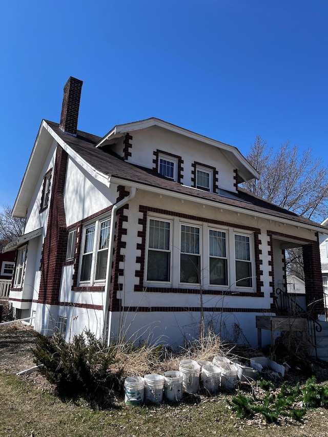 722 2nd St SW, Willmar, MN 56201 - view of property exterior with a chimney