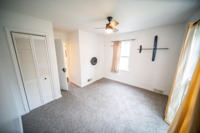 109 2nd St SW, Blooming Prairie, MN 55917 - unfurnished bedroom with carpet floors, a closet, baseboards, and ceiling fan