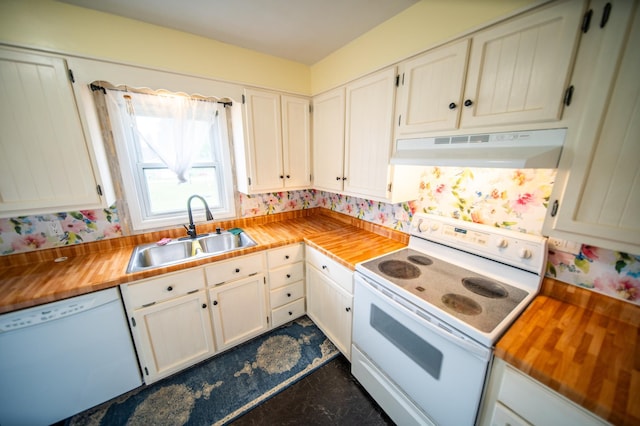 109 2nd St SW, Blooming Prairie, MN 55917 - kitchen with white appliances, under cabinet range hood, a sink, butcher block countertops, and wallpapered walls