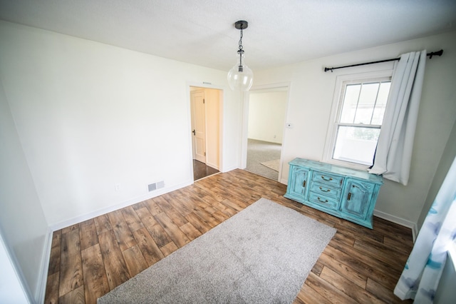 109 2nd St SW, Blooming Prairie, MN 55917 - spare room featuring wood finished floors and baseboards