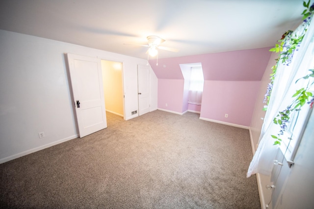 109 2nd St SW, Blooming Prairie, MN 55917 - additional living space featuring a ceiling fan, carpet, baseboards, and lofted ceiling