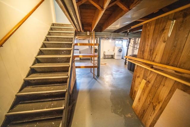 109 2nd St SW, Blooming Prairie, MN 55917 - staircase with washer / dryer and concrete flooring