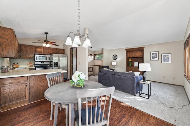 7618 Borman Way, Inver Grove Heights, MN 55076 - dining space with a ceiling fan, dark wood-style floors, a chandelier, and vaulted ceiling