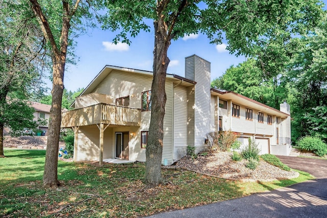 7618 Borman Way, Inver Grove Heights, MN 55076 - view of front facade with a chimney, driveway, and an attached garage