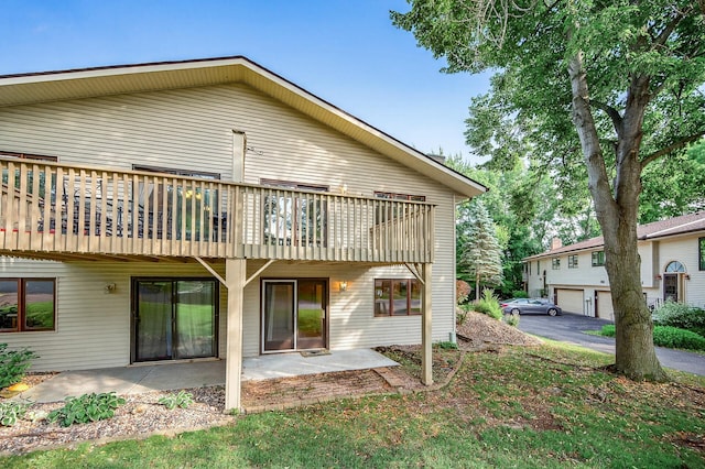 7618 Borman Way, Inver Grove Heights, MN 55076 - rear view of house featuring a patio and a wooden deck